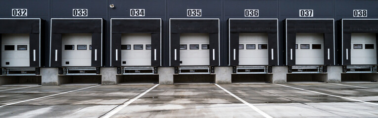 Big distribution warehouse with industrial doors for loading dock trucks