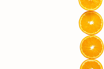 oranges cut into round slices isolated on white background. Tropical fruit