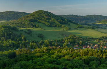 Fototapeta na wymiar View from Jehla hill over Ceska Kamenice town in spring misty morning