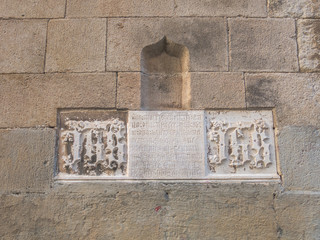 Detail of marble with Gothic writing, with a passage of the bible. Cathedral of Barcelona. Barcelona, Spain