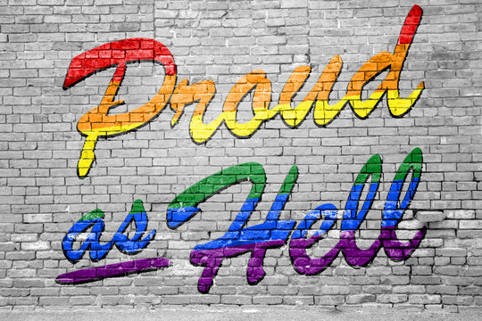 Proud as hell rainbow lettering gay pride Graffiti on Brick Wall 