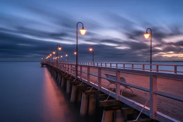 Foto op Plexiglas De Oostzee, Sopot, Polen Illuminated wooden pier in Gdynia Orlowo. Early morning on the Baltic Sea. Poland, Europe.