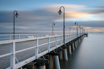 Wooden pier in Gdynia Orlowo. Early morning on the Baltic Sea. Poland, Europe.