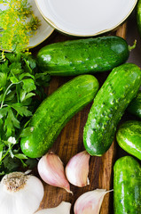Preparation marinated conservation cucumbers with herbs, garlic, salt, and spice.