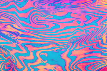 Fototapeta premium Abstract trendy neon colored psychedelic fluorescent striped zebra textured background.