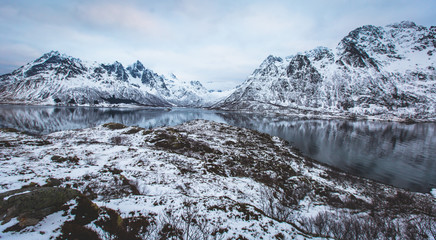 Fototapeta na wymiar Beautiful panoramic winter view of Austnesfjorden, Sildpollen bay, Austvagoya island, Vagan Municipality, Nordland, Lofoten Islands, Norway, with fjord and mountains