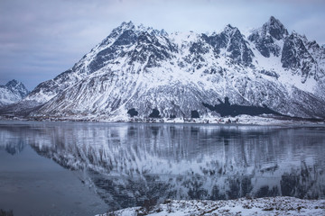 Beautiful panoramic winter view of Austnesfjorden, Sildpollen bay, Austvagoya island, Vagan Municipality, Nordland,  Lofoten Islands, Norway, with fjord and mountains