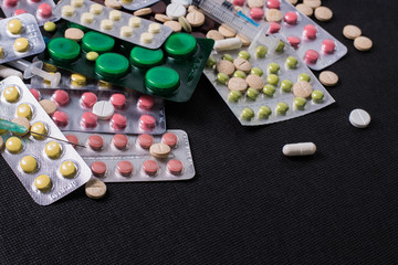 pharmaceuticals antibiotics pills medicine /colorful antibacterials pills on white background /capsule pill medicine. Creative idea. Drugs. Sad. Die. Illness