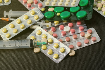 pharmaceuticals antibiotics pills medicine /colorful antibacterials pills on white background /capsule pill medicine. Creative idea. Drugs. Sad. Die. Illness