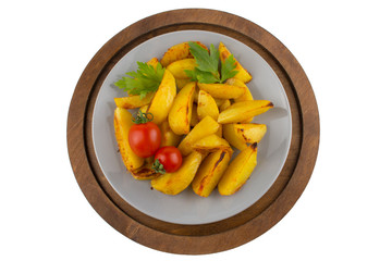 Baked potato with vegetables on a wooden tray. Rustic potato slices decorated with cherry tomatoes and greens. plate of potatoes isolated on white