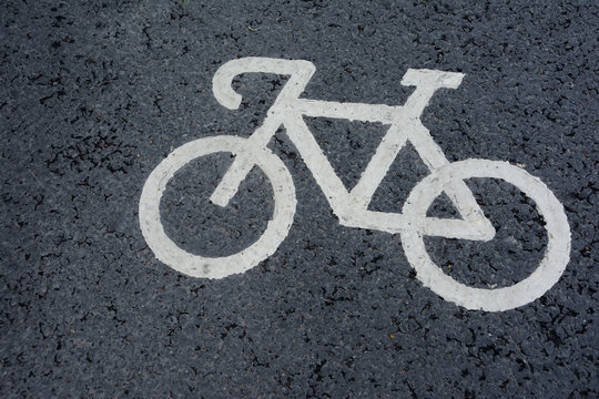 the bicycle symbol drawn on asphalt of a bicycle track marking