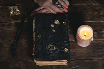 Book of magic in a magician hands. Witchcraft.