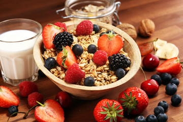 Cereal. Bowl of granola cereals, fruits and milk for breakfast. Muesli with cereals.
