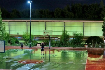 red and green basketball field after the rain