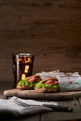 Tasty salmon sandwich with salad