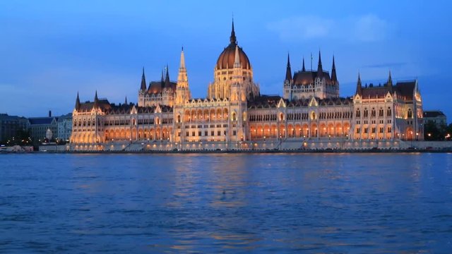Beautiful evening view of the building of the Hungarian Parliament and the Danube River in Budapest, Hungary