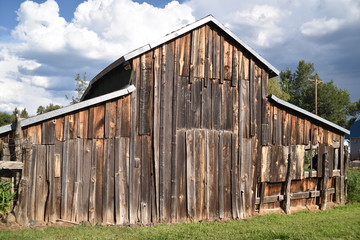 Vintage wooden, chicken coop and split-rail barbed wire fence