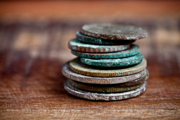 Stack of different ancient copper coins with patina.