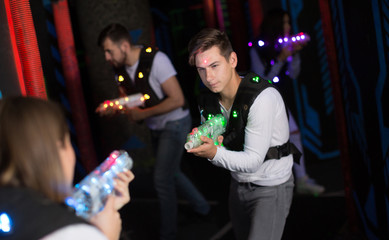 Young man on laser tag arena
