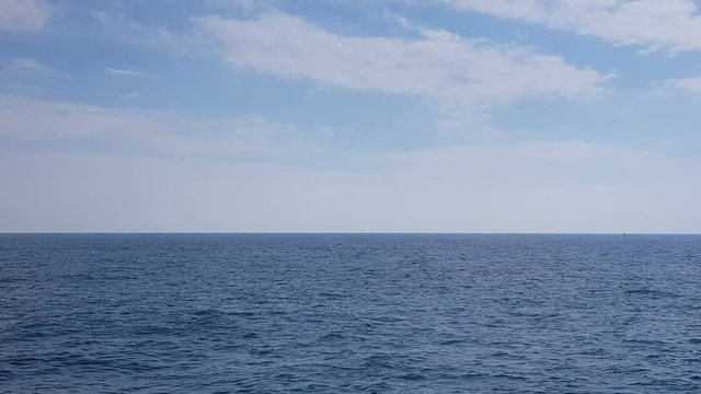 Blue sky with clouds in sunny weather over the ocean.View of the ocean and clouds in the sky.