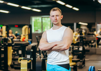 Fototapeta na wymiar Fitness men posing in the gym