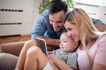 Modern family using a digital tablet