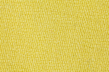 Yellow fabric background texture. Detail of textile material close-up