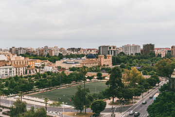 Fototapeta na wymiar Valencia cityscape, bridge across River Turia, currently a enormous park. Football field. Spain