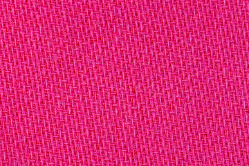 Pink fabric background texture. Detail of textile material close-up