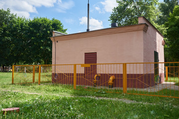 Gas unit booth surrounded by yellow fence