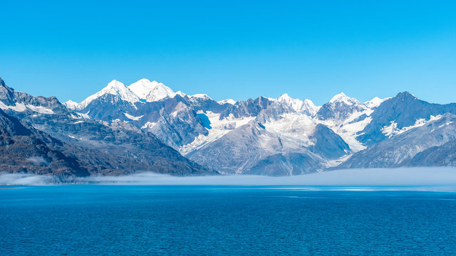 Glacier Bay National Park, Alaska. Spectacular sweeping vista of ice capped/ snow covered mountains, glaciers, wildlife landscape. Absolutely breathtaking natural untouched serene nature views.