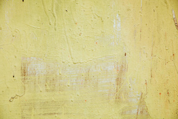 Abstract colorful wall texture and background. Close-up iron surface with old yellow paint