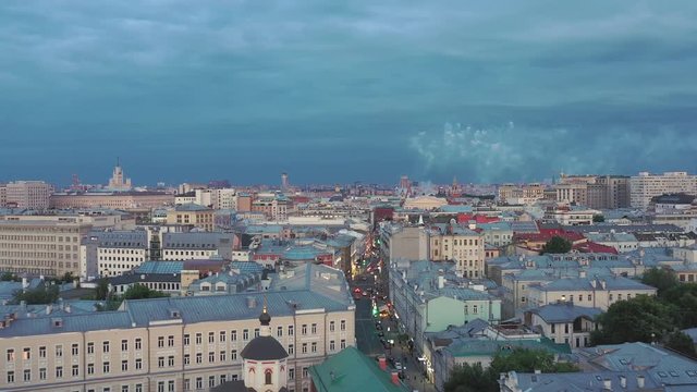 Aerial photography in the center of Moscow. Drone flies in the direction of Red Square. And over the red square there is dissipated the smoke from the salute in honor of the holiday of the day of Russ