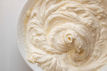 Whipped Frosting on a White Background Yummy frosting with a pleasant texture. Light and airy image.