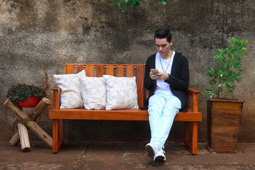Fototapeta premium man sitting on a bench in the park