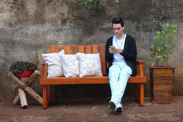 Fototapeta premium man sitting on a bench in the park