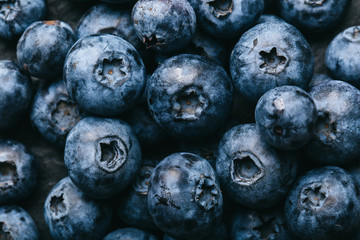 Fresh blueberry background. Texture blueberry berries close up. Vegan and vegetarian concept.