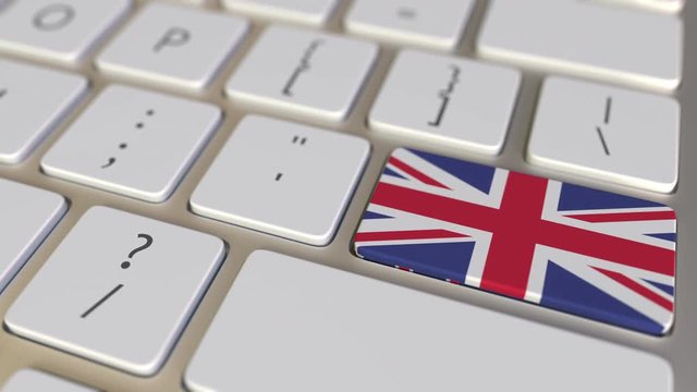 Key with flag of Australia on the computer keyboard switches to key with flag of Great Britain, cooperation or relocation related animation