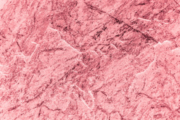 Vintage pink background. Rough painted wall of fiesta color. Imperfect plane of rosy colored. Uneven old decorative toned backdrop of rouge tint. Texture of pink hue. Ornamental stony surface.