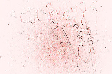 Vintage pink background. Rough painted wall of living coral color. Imperfect plane of beige colored. Uneven old decorative toned backdrop of beige tint. Texture of pink hue. Ornamental stony surface.