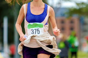 Close-up of a girl running a marathon