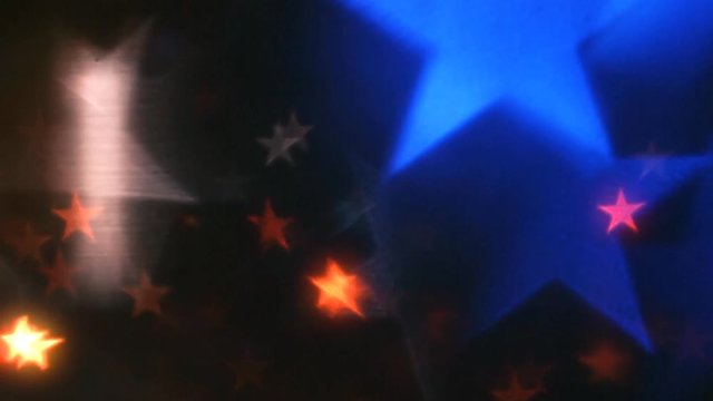 Americana Star Flow One 4K Loop features red, white, and blue stars of various sizes floating across screen in an abstract composite loop