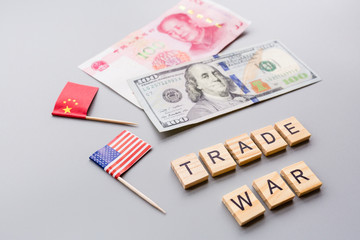 Creative top view flat lay of China and USA flags and cash money, mockup and copy space on gray background in minimal style. Concept of trade war between USA and China