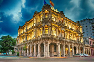  view of the spanish embassy in havana, cuba at dusk - obrazy, fototapety, plakaty