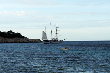 Obraz premium The three-masted sailboat stopped for the night in the bay of Sant Miquel.Ibiza Island.Spain.