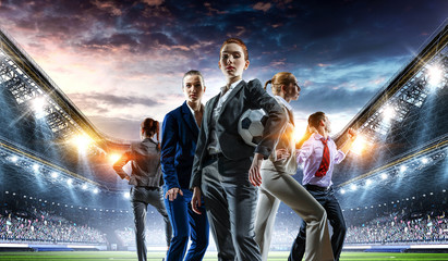 Naklejka premium Business team on football stadium. Mixed media