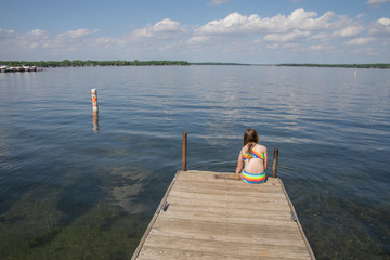 Fototapeta na wymiar Young Girl visits the Tourist Area of Lake Okoboji in Northern Iowa