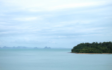 little island in a sea and archipelago further out to the horizon.aqua sea and so many cloud,Andaman sea,Thailand coast.