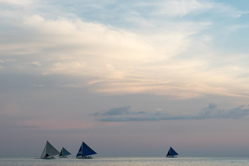 Fototapeta na wymiar Yachts on the horizon in the dusk