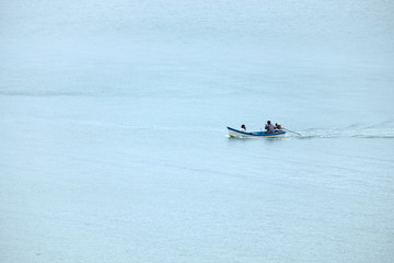 KRABI,THAILAND-AUGUST 18, 2018 : Lifestyle of local fisherman,the fisherman is standing on his small fishing boat and doing something about his occupation in a sea